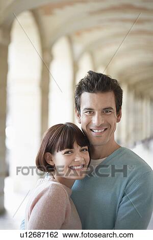 Couple embracing under archway head and shoulders View Large Photo Image Stock Image - Couple embracing under archway head and shoulders. Fotosearch