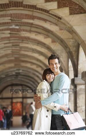 Couple Hugging in Shopping Arcade View Large Photo Image Stock Image - Couple Hugging in Shopping Arcade. Fotosearch