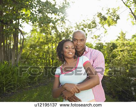 Stock Photo - Couple in garden portrait. Fotosearch