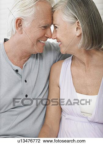 Couple sitting face to face View Large Photo Image Stock Image - Couple sitting face to face. Fotosearch