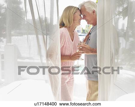 Couple standing on verandah face to face side view View Large Photo Image Stock Image - Couple standing on verandah face to face side view. Fotosearch
