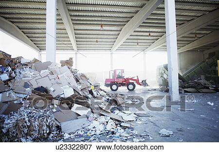Digger truck on construction site surrounded by rubble View Large Photo Image Stock Photo - Digger truck on construction site surrounded by rubble. Fotosearch