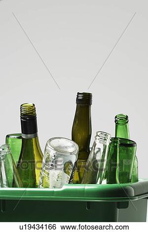Empty bottles in green container View Large Photo Image Stock Photograph - Empty bottles in green container. Fotosearch
