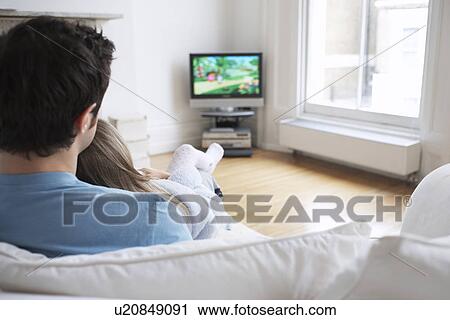 Father and daughter (5-6) watching cartoons in television back view View Large Photo Image Stock Image - Father and daughter (5-6) watching cartoons in television back view. Fotosearch