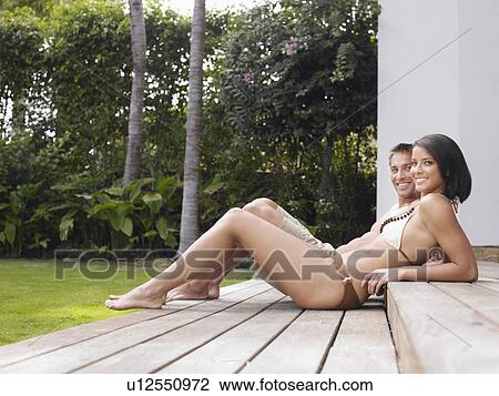 Happy Young Couple Relaxing Outdoors View Large Photo Image Stock Image - Happy Young Couple Relaxing Outdoors. Fotosearch