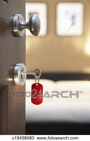 Key in hotel room's door View Large Photo Image Stock Image - Key in hotel room's door. Fotosearch