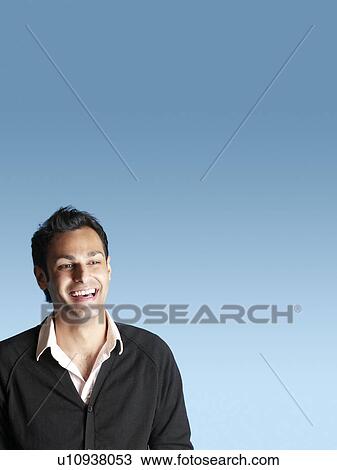 Laughing mid adult man on blue background View Large Photo Image Stock Image - Laughing mid adult man on blue background. Fotosearch