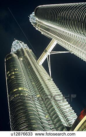 Malaysia Kuala Lumpur Petronas Towers night low angle view View Large Photo Image Stock Image - Malaysia Kuala Lumpur Petronas Towers night low angle view. Fotosearch