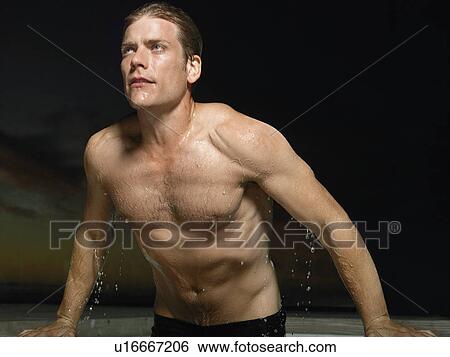 Man emerging from water outdoors View Large Photo Image Stock Photograph - Man emerging from water outdoors. Fotosearch