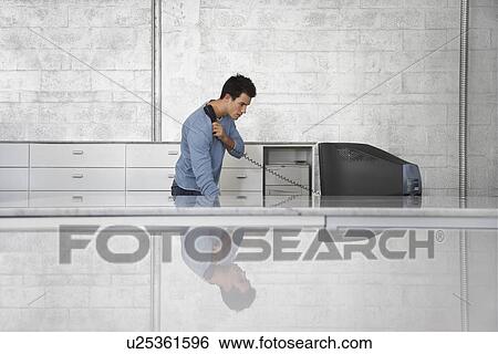 Stock Photograph - Man in Office. Fotosearch