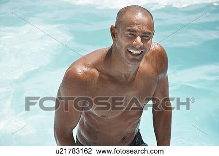 Man in swimming pool smiling half length View Large Photo Image Stock Image - Man in swimming pool smiling half length. Fotosearch