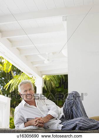 Man reclining on verandah portrait View Large Photo Image Stock Image - Man reclining on verandah portrait. Fotosearch