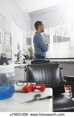 Man standing in barbers shop View Large Photo Image Stock Photography - Man standing in barbers shop. Fotosearch