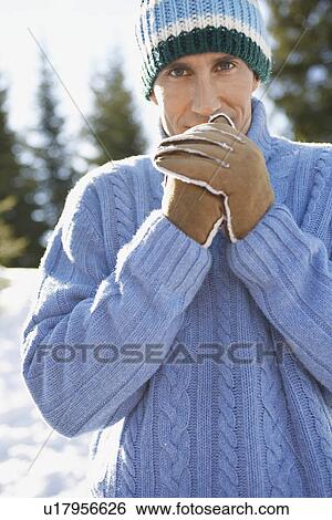 Stock Photograph - Man wearing winter clothing portrait. Fotosearch