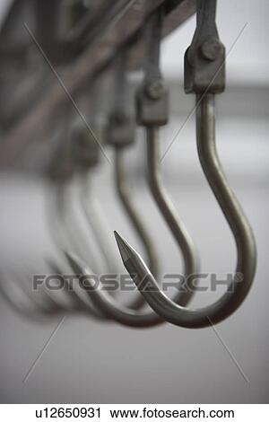 Meat Hooks in a row View Large Photo Image Stock Image - Meat Hooks in a row. Fotosearch