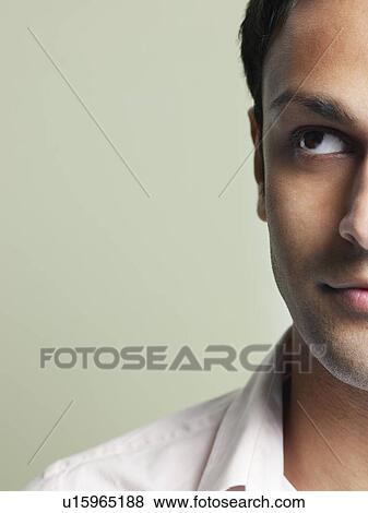 Mid adult man looking up close-up (cropped) View Large Photo Image Stock Photo - Mid adult man looking up close-up (cropped). Fotosearch