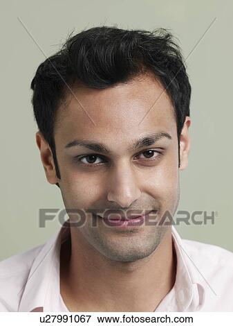 Mid adult man smiling close-up View Large Photo Image Stock Photo - Mid adult man smiling close-up. Fotosearch