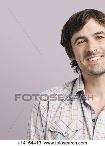 Stock Image - Mid adult man smiling. Fotosearch