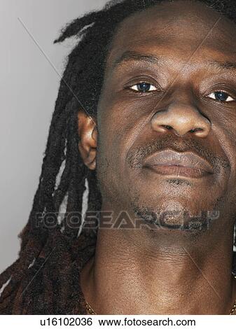 Mid adult man with dreadlocks close-up View Large Photo Image Stock Photograph - Mid adult man with dreadlocks close-up. Fotosearch