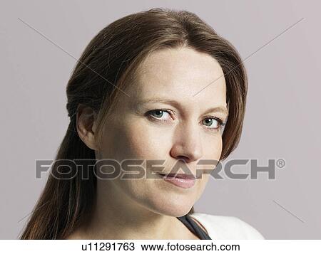 Mid adult woman close-up View Large Photo Image Stock Image - Mid adult woman close-up. Fotosearch