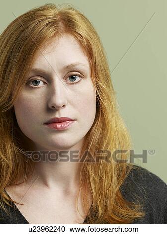 Stock Image - Mid adult woman close-up. Fotosearch