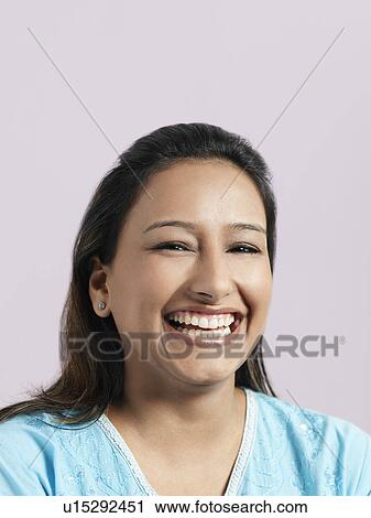 Stock Image - Mid-adult woman laughing. Fotosearch