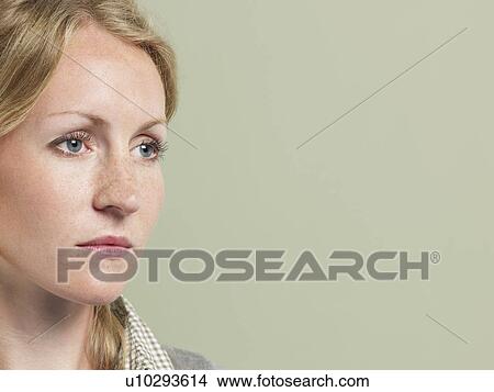 Mid adult woman looking away close-up View Large Photo Image Picture - Mid adult woman looking away close-up. Fotosearch