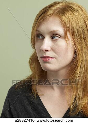 Mid adult woman looking away View Large Photo Image Stock Image - Mid adult woman looking away. Fotosearch