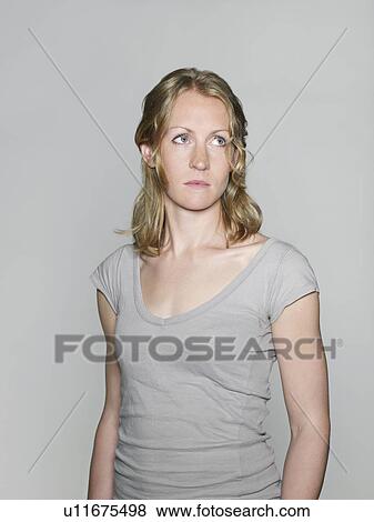 Mid-adult woman looking away View Large Photo Image Stock Photo - Mid-adult woman looking away. Fotosearch