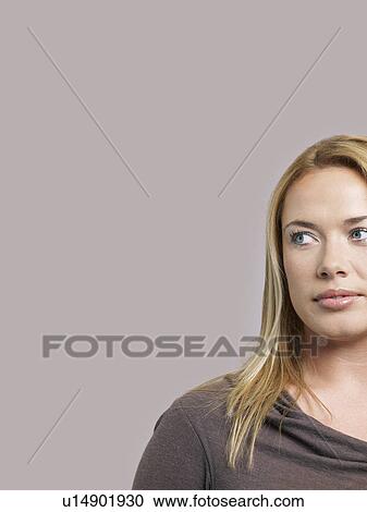 Mid adult woman looking to side View Large Photo Image Stock Image - Mid adult woman looking to side. Fotosearch