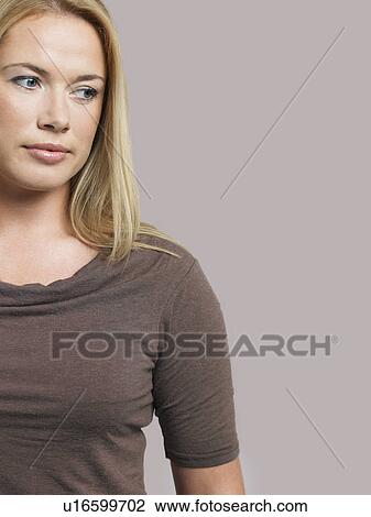 Mid adult woman looking to side View Large Photo Image Stock Image - Mid adult woman looking to side. Fotosearch