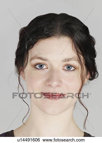 Mid adult woman smiling close-up View Large Photo Image Stock Photograph - Mid adult woman smiling close-up. Fotosearch