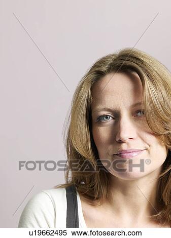 Stock Photography - Mid-adult woman smiling close-up. Fotosearch