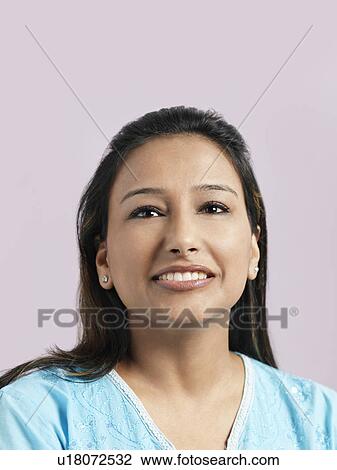 Stock Image - Mid-adult woman smiling. Fotosearch