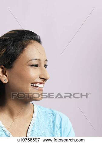 Stock Photo - Mid-adult woman smiling. Fotosearch