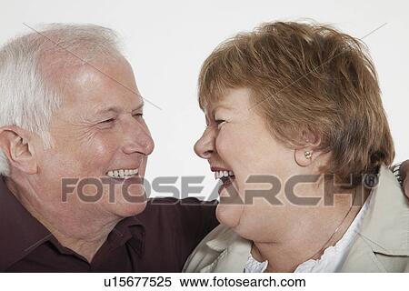 Middle-aged couple laughing close-up View Large Photo Image Stock Photography - Middle-aged couple laughing close-up. Fotosearch