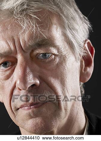 Stock Image - Middle-aged man looking away close-up. Fotosearch