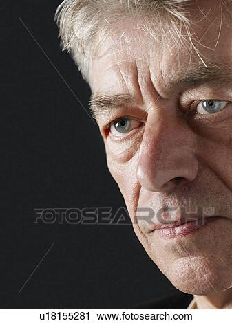 Stock Image - Middle-aged man looking away close-up. Fotosearch