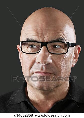 Middle-aged man looking away close-up View Large Photo Image Stock Photo - Middle-aged man looking away close-up. Fotosearch