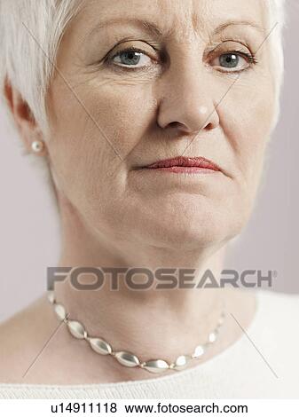 Stock Photo - Middle-aged woman close-up (cropped). Fotosearch