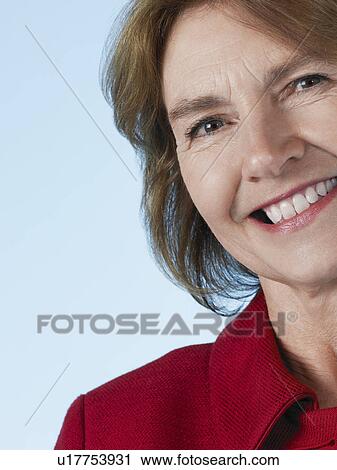 Middle-aged woman smiling close-up View Large Photo Image Stock Image - Middle-aged woman smiling close-up. Fotosearch