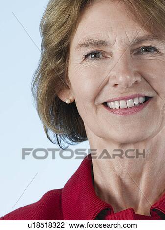 Stock Image - Middle-aged woman smiling close-up. Fotosearch