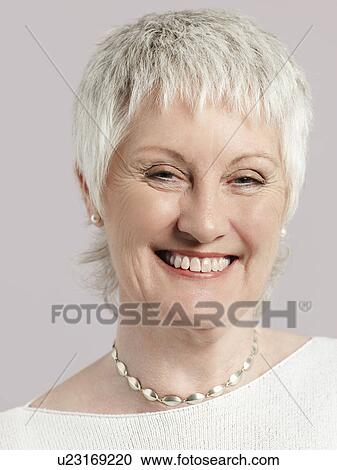 Stock Image - Middle-aged woman smiling close-up. Fotosearch