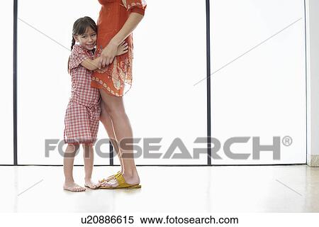 Mother and daughter (5-6) hugging side view View Large Photo Image Stock Photography - Mother and daughter (5-6) hugging side view. Fotosearch