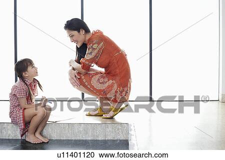 Mother and daughter (5-6) talking indoors side view View Large Photo Image Stock Image - Mother and daughter (5-6) talking indoors side view. Fotosearch