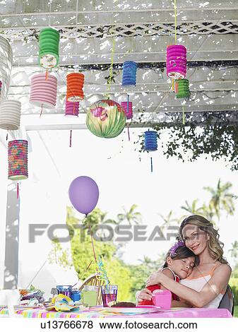 Mother and daughter (7-9) at birthday table girl sleeping View Large Photo Image Stock Photo - Mother and daughter (7-9) at birthday table girl sleeping. Fotosearch
