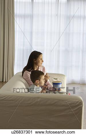 Mother With Son Eating Ice Cream in Living Room View Large Photo Image Stock Image - Mother With Son Eating Ice Cream in Living Room. Fotosearch