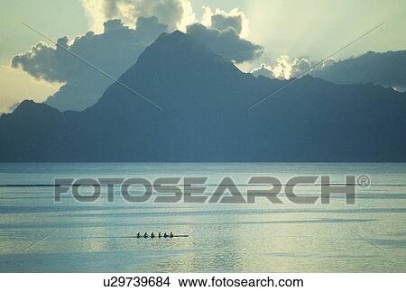 Mountain silhouette upon river sunrise View Large Photo Image Picture - Mountain silhouette upon river sunrise. Fotosearch