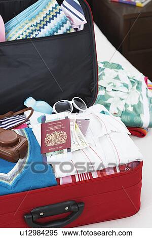Open suitcase on bed elevated view close up View Large Photo Image Stock Photography - Open suitcase on bed elevated view close up. Fotosearch