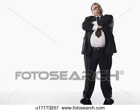 Stock Photo - Overweight businessman with arms crossed. Fotosearch